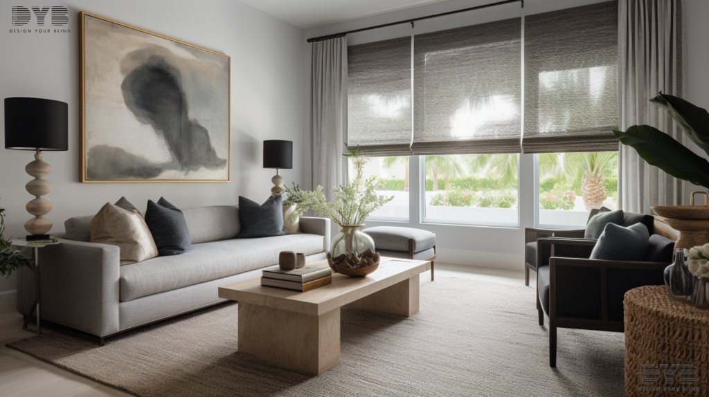 A living room in Palm Beach Gardens, FL with woven wood shades, a plush, grey sofa, and a coffee table.