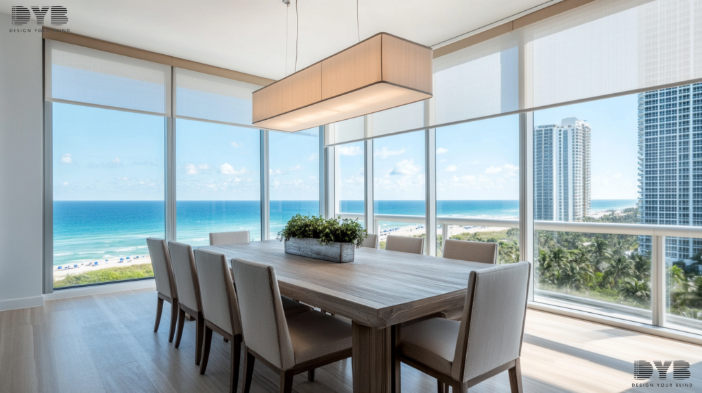 A minimalist dining room in Boca Raton, Florida, with blackout roller shades and ocean views.
